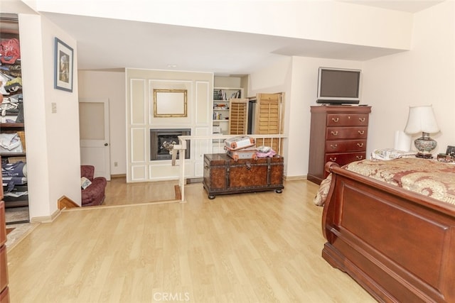 1313 Valley View Rd Unit 202, Glendale, CA 91202 - bedroom with light wood-type flooring and a fireplace