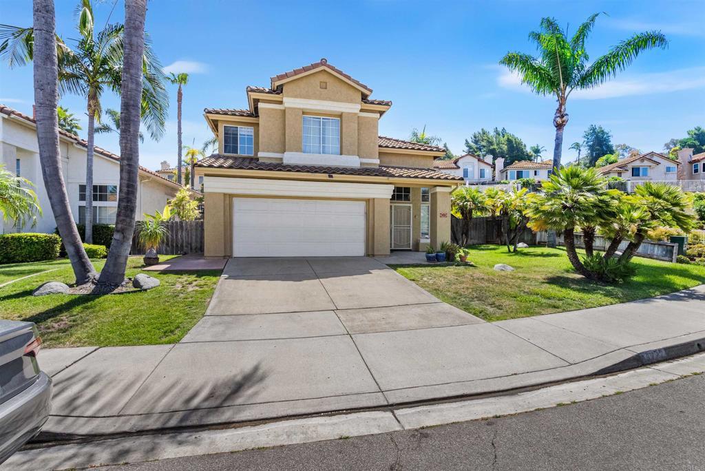 972 Tempera Ct, Oceanside, CA 92057 - mediterranean / spanish-style house featuring stucco siding, driveway, a tile roof, and a garage