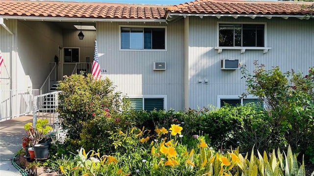 636 NW Avenida Sevilla # O, Laguna Woods, CA 92637 - view of side of property with a tile roof and stairway