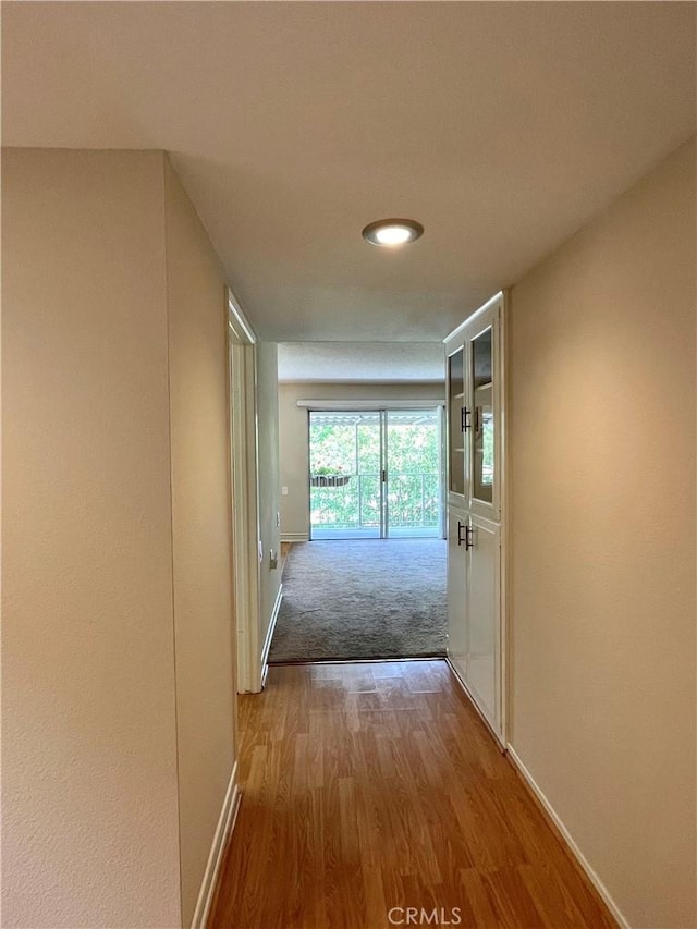 636 NW Avenida Sevilla # O, Laguna Woods, CA 92637 - hallway with baseboards and wood finished floors