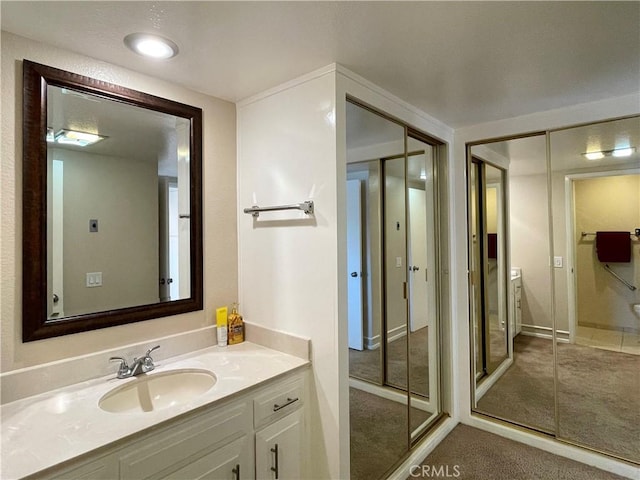 636 NW Avenida Sevilla # O, Laguna Woods, CA 92637 - bathroom with vanity and baseboards