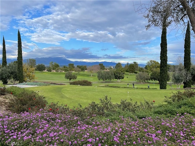 636 NW Avenida Sevilla # O, Laguna Woods, CA 92637 - view of property's community featuring a mountain view, a yard, an area to practice putting, and view of golf course