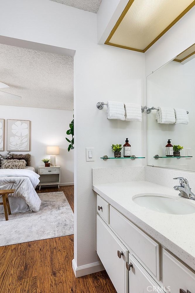 1626 S Mayflower Ave Unit A, Monrovia, CA 91016 - bathroom featuring vanity, wood finished floors, and a textured ceiling