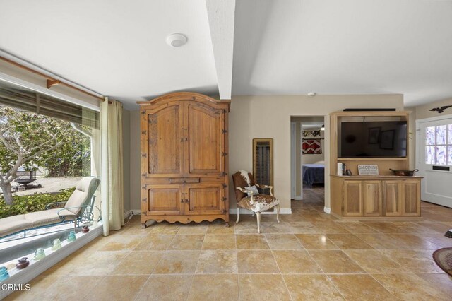 401 S Brent St, Ventura, CA 93003 - living area featuring beamed ceiling and a heating unit
