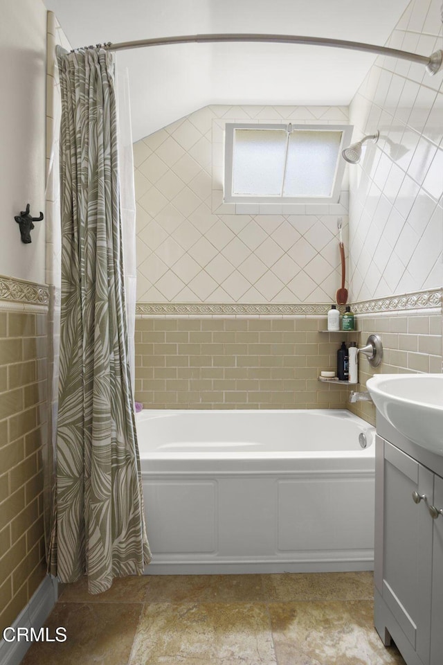 401 S Brent St, Ventura, CA 93003 - full bath featuring tile walls, vanity, and shower / tub combo with curtain