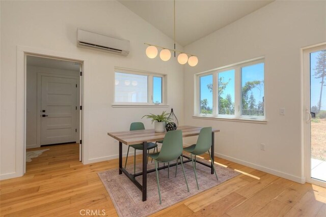 866 Central Park Dr, Paradise, CA 95969 - dining room with an AC wall unit, light wood-style floors, healthy amount of natural light, and lofted ceiling