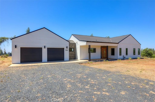 866 Central Park Dr, Paradise, CA 95969 - modern farmhouse style home featuring board and batten siding, a porch, a metal roof, and a garage