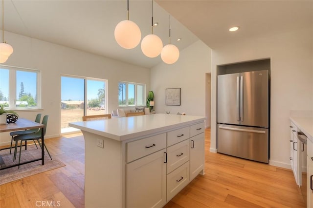 866 Central Park Dr, Paradise, CA 95969 - kitchen featuring freestanding refrigerator, light countertops, light wood-style flooring, white cabinets, and recessed lighting
