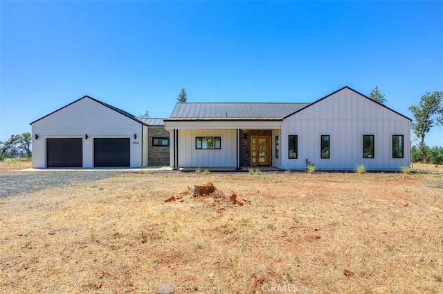 866 Central Park Dr, Paradise, CA 95969 - modern farmhouse style home with board and batten siding, french doors, and a metal roof
