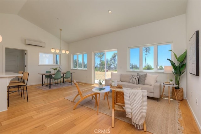866 Central Park Dr, Paradise, CA 95969 - living room featuring a wall mounted AC, light wood-style floors, and high vaulted ceiling