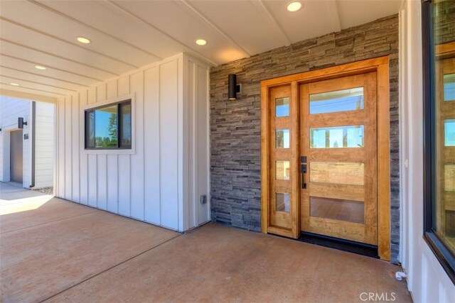 866 Central Park Dr, Paradise, CA 95969 - property entrance featuring board and batten siding and stone siding
