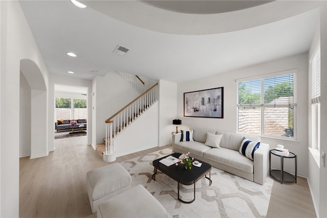 23812 Cook Ct, Wildomar, CA 92595 - living area with light wood-type flooring, healthy amount of natural light, stairway, and recessed lighting