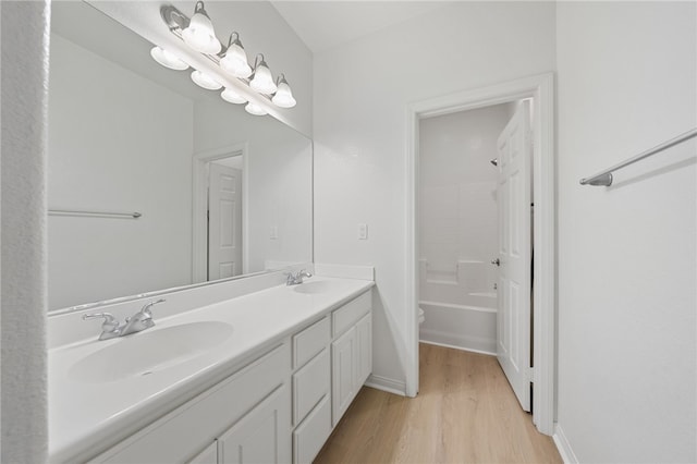 23812 Cook Ct, Wildomar, CA 92595 - full bath featuring wood finished floors, double vanity, and shower / bathtub combination
