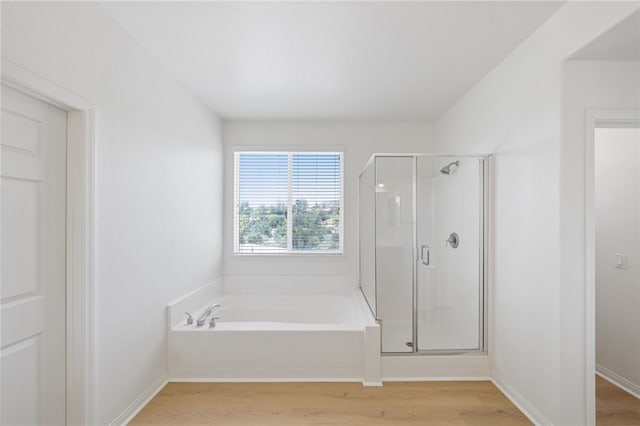 23812 Cook Ct, Wildomar, CA 92595 - bathroom with a bath, a shower stall, and wood finished floors