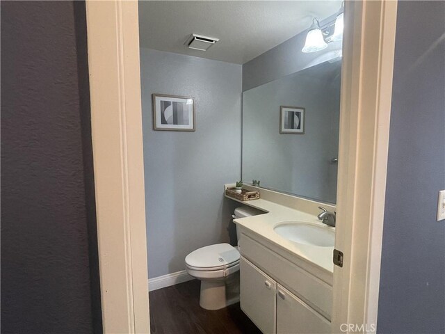23330 Dover Ln Unit 94, Yorba Linda, CA 92887 - half bathroom with vanity and wood finished floors