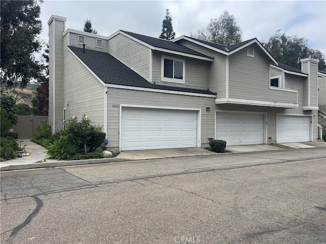 23330 Dover Ln Unit 94, Yorba Linda, CA 92887 - view of front of property featuring a chimney and a garage