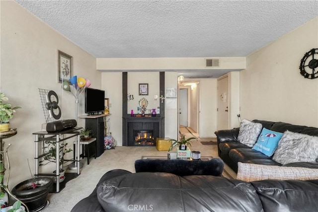 13903 Sherman Way Unit 8, Van Nuys, CA 91405 - carpeted living room with a textured ceiling and a lit fireplace
