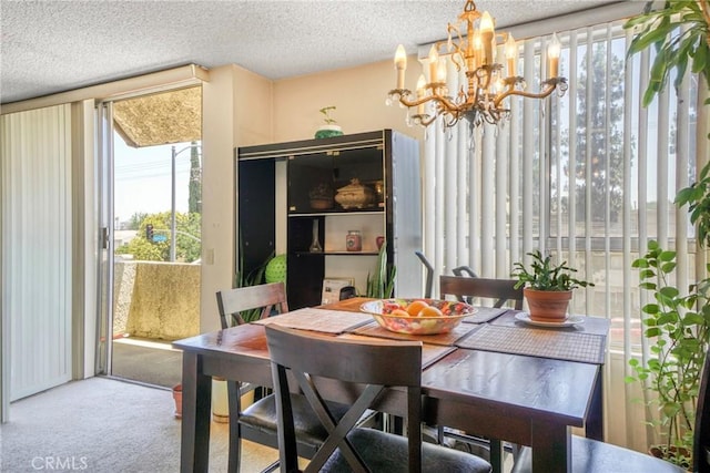 13903 Sherman Way Unit 8, Van Nuys, CA 91405 - carpeted dining area with a chandelier and a textured ceiling