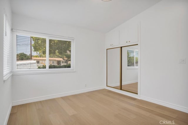1440 Riviera Dr, Pasadena, CA 91107 - unfurnished bedroom with light wood-style flooring and a closet