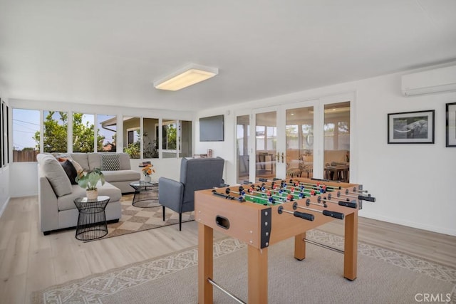1440 Riviera Dr, Pasadena, CA 91107 - playroom featuring a wall mounted AC and wood finished floors