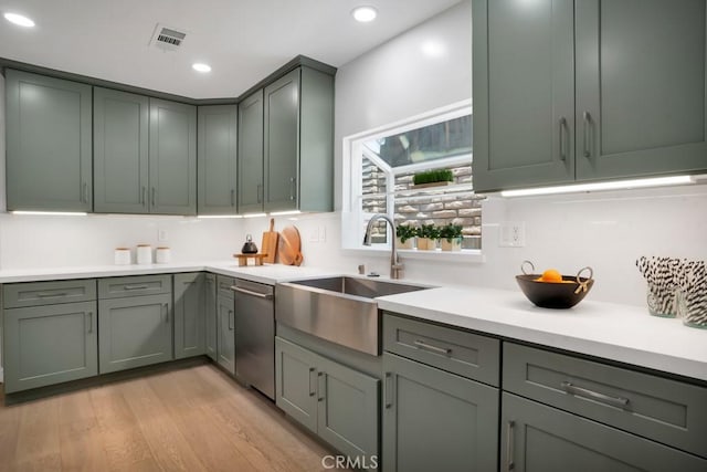 1440 Riviera Dr, Pasadena, CA 91107 - kitchen with stainless steel dishwasher, recessed lighting, light countertops, light wood-style floors, and gray cabinetry