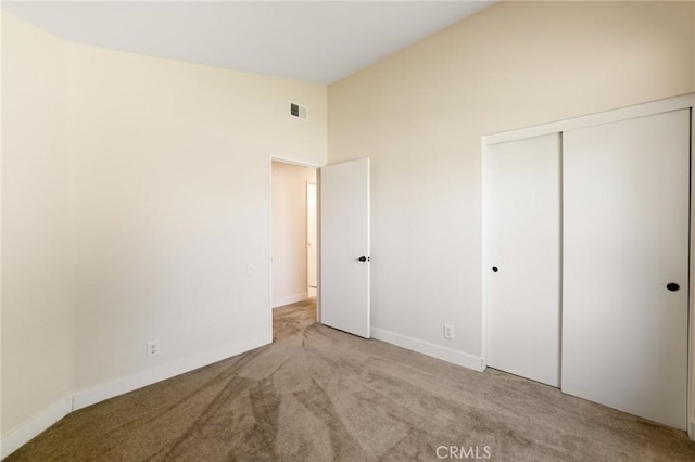 4108 Sunnysage Dr, Jurupa Valley, CA 92509 - unfurnished bedroom featuring carpet, a closet, and vaulted ceiling