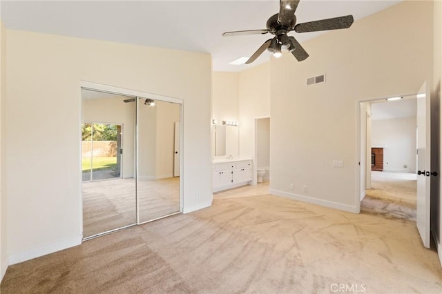 4108 Sunnysage Dr, Jurupa Valley, CA 92509 - unfurnished bedroom with carpet, high vaulted ceiling, a closet, ensuite bathroom, and a ceiling fan