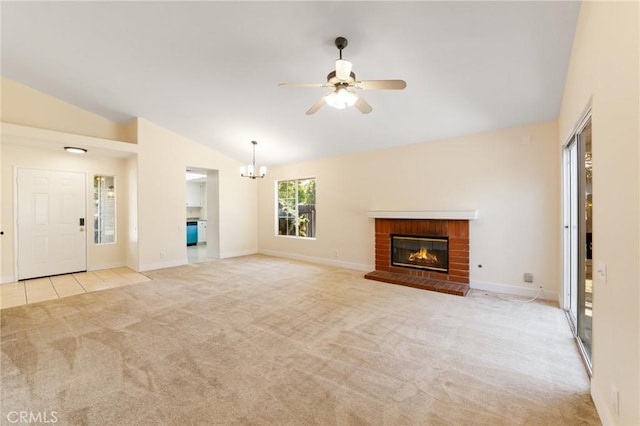 4108 Sunnysage Dr, Jurupa Valley, CA 92509 - unfurnished living room with vaulted ceiling, light colored carpet, a brick fireplace, a chandelier, and a ceiling fan