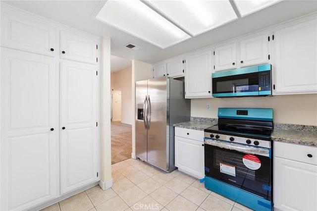4108 Sunnysage Dr, Jurupa Valley, CA 92509 - kitchen with appliances with stainless steel finishes, light tile patterned flooring, white cabinets, light colored carpet, and light stone countertops