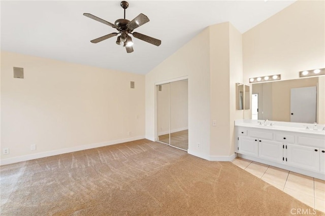 4108 Sunnysage Dr, Jurupa Valley, CA 92509 - unfurnished bedroom with light carpet, a closet, high vaulted ceiling, ensuite bath, and ceiling fan