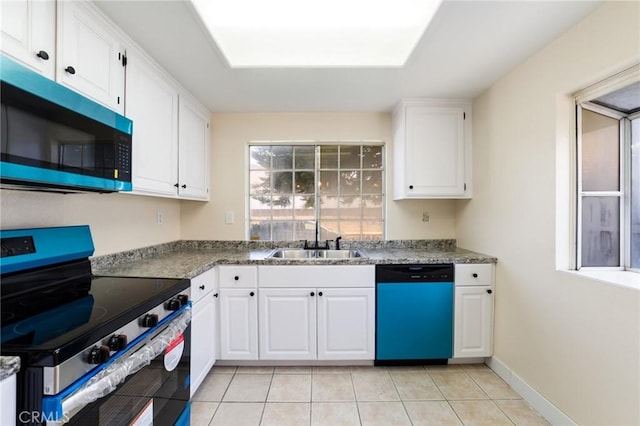 4108 Sunnysage Dr, Jurupa Valley, CA 92509 - kitchen with appliances with stainless steel finishes, white cabinets, light tile patterned floors, and stone counters