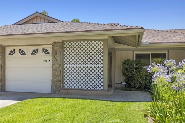 26817 Oak Branch Cir, Newhall, CA 91321 - view of home's exterior featuring stone siding, a lawn, and a garage