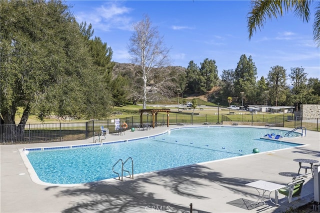 26817 Oak Branch Cir, Newhall, CA 91321 - community pool featuring view of wooded area and a patio area
