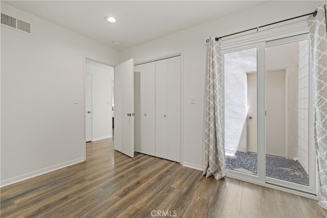 26817 Oak Branch Cir, Newhall, CA 91321 - unfurnished bedroom with wood finished floors, a closet, access to exterior, and recessed lighting