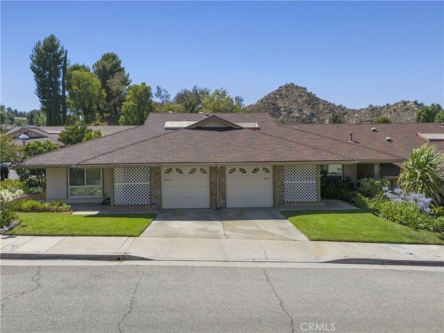 26817 Oak Branch Cir, Newhall, CA 91321 - single story home featuring a garage, concrete driveway, a front yard, and a shingled roof