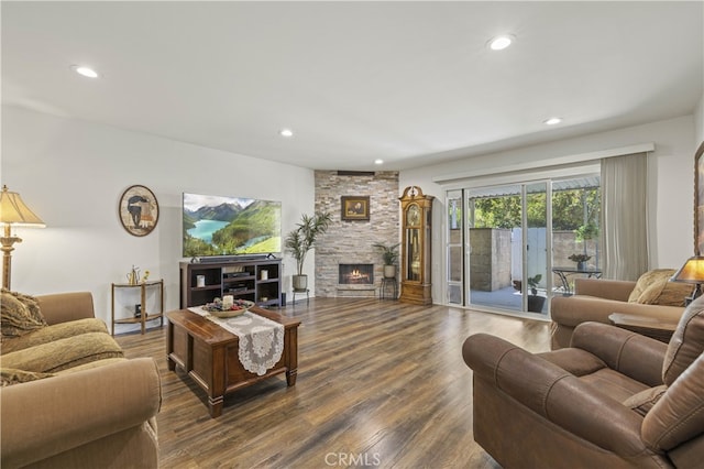 26817 Oak Branch Cir, Newhall, CA 91321 - living area with dark wood-type flooring, a stone fireplace, and recessed lighting