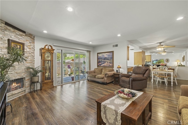 26817 Oak Branch Cir, Newhall, CA 91321 - living area featuring a stone fireplace, hardwood / wood-style floors, ceiling fan, and recessed lighting