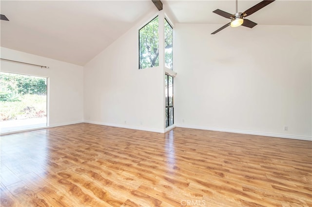 9411 Friendly Woods Ln, Whittier, CA 90605 - unfurnished living room with high vaulted ceiling, light wood-style floors, and ceiling fan
