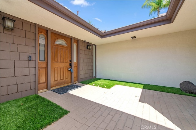 9411 Friendly Woods Ln, Whittier, CA 90605 - view of exterior entry featuring stucco siding