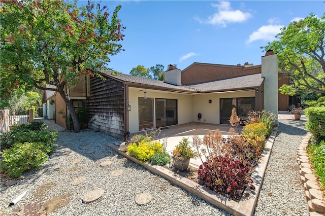 9411 Friendly Woods Ln, Whittier, CA 90605 - rear view of property featuring a patio and a chimney