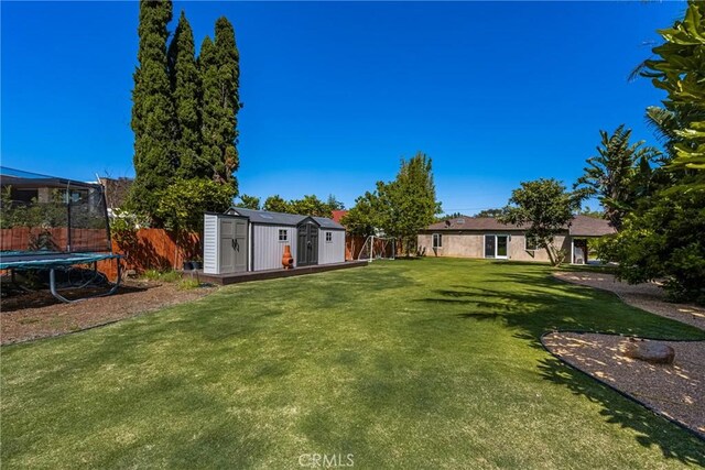 2023 Republic Ave, Costa Mesa, CA 92627 - view of yard with a storage shed and a trampoline