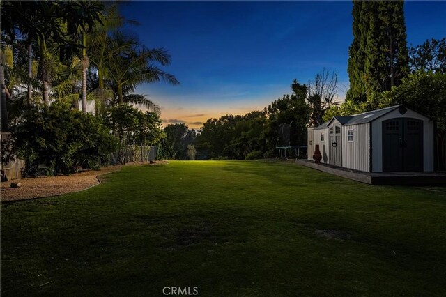 2023 Republic Ave, Costa Mesa, CA 92627 - view of green lawn with a trampoline and a storage unit