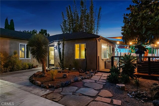 2023 Republic Ave, Costa Mesa, CA 92627 - view of front facade with stucco siding and a deck