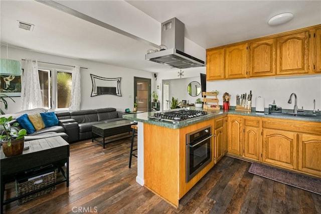 2023 Republic Ave, Costa Mesa, CA 92627 - kitchen featuring stainless steel appliances, island range hood, a peninsula, open floor plan, and brown cabinetry