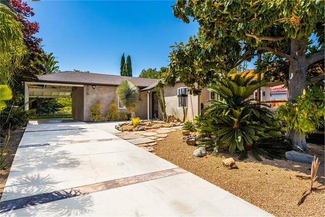 2023 Republic Ave, Costa Mesa, CA 92627 - view of front of home with stucco siding, driveway, and a carport