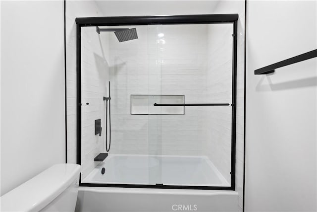 990 Nesthorn Dr, Crestline, CA 92325 - full bathroom featuring toilet and shower / bath combination with glass door