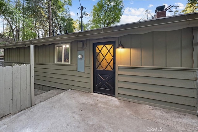 990 Nesthorn Dr, Crestline, CA 92325 - doorway to property featuring a chimney, board and batten siding, and a patio area