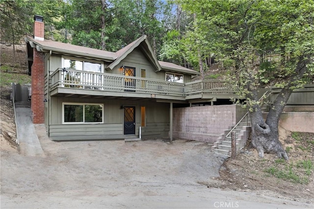 990 Nesthorn Dr, Crestline, CA 92325 - chalet / cabin with a chimney, a deck, and stairway