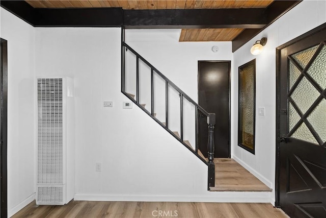 990 Nesthorn Dr, Crestline, CA 92325 - entryway with a heating unit, wood finished floors, stairway, and a wooden ceiling with exposed beams