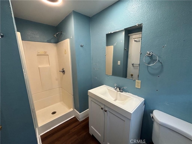 1646 Cimarron St, Los Angeles, CA 90019 - full bathroom with wood finished floors, a stall shower, and vanity